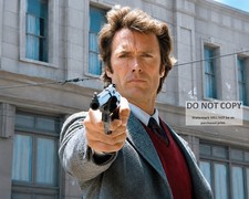 CLINT EASTWOOD BRANDISHING HIS .44 MAGNUM IN 