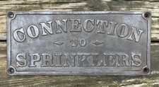RARE 1915 CONNECTION TO SPRINKLERS PLAQUE picture